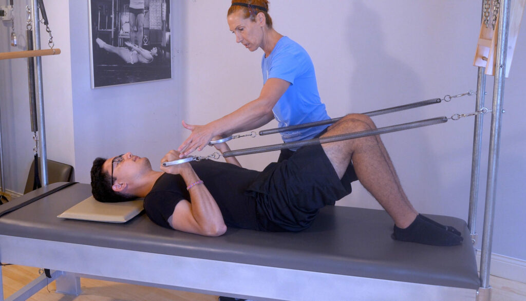 Vivian working with a client using Authentic Pilates